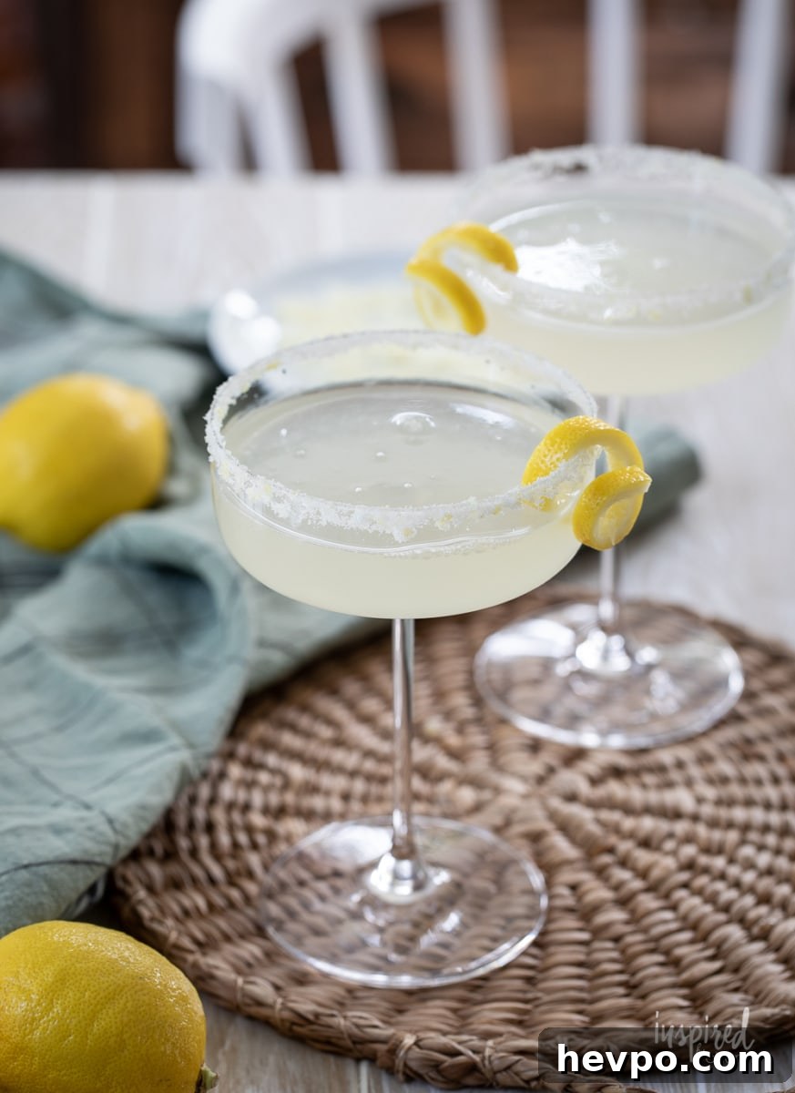 Zesty Lemon Drop Martini Recipe: How to Make the Classic Cocktail 10 Lemon Drop Martini in martini glass.