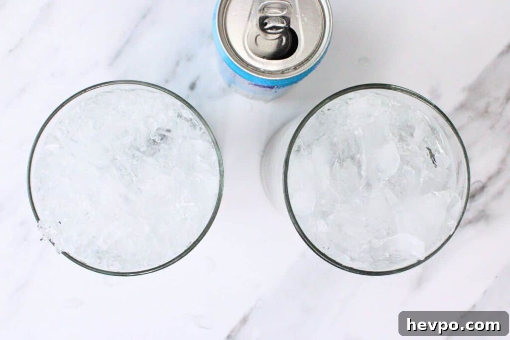 fill lavender mojito glass with crushed ice and club soda