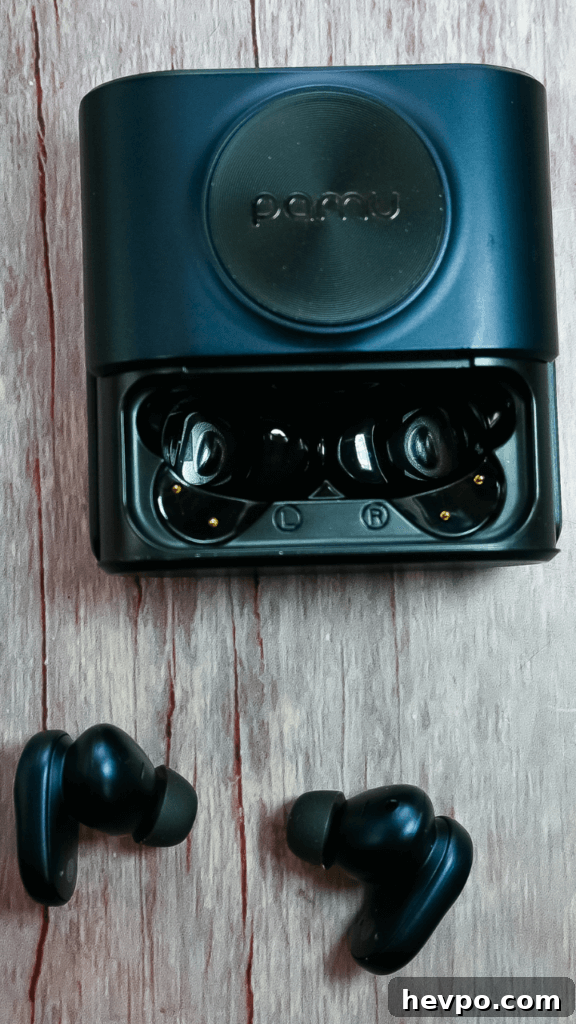 The PaMu Slide 2 ANC Wireless Earbuds case slide open and the earbuds below them.