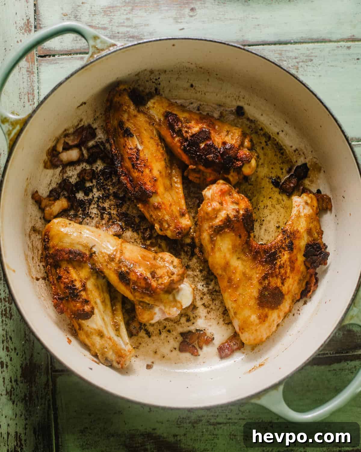 seared turkey wings in a pot. 