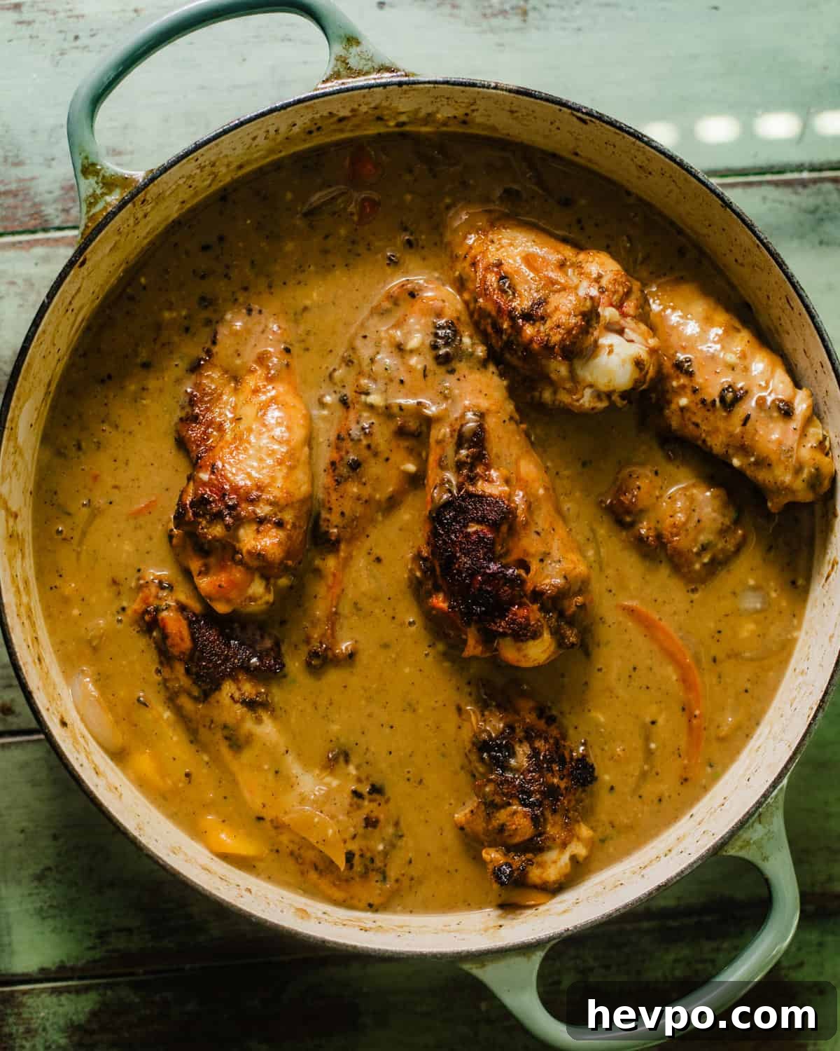 turkey wings in a pot smothered in homemade gravy. 