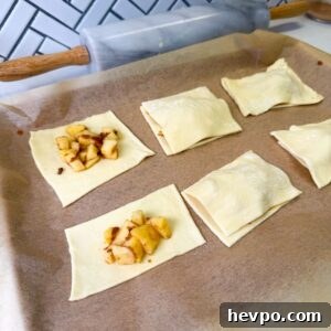 Classic Apple Hand Pies Made with Flaky Puff Pastry 8 Apple filling on puff pastry rectangles.