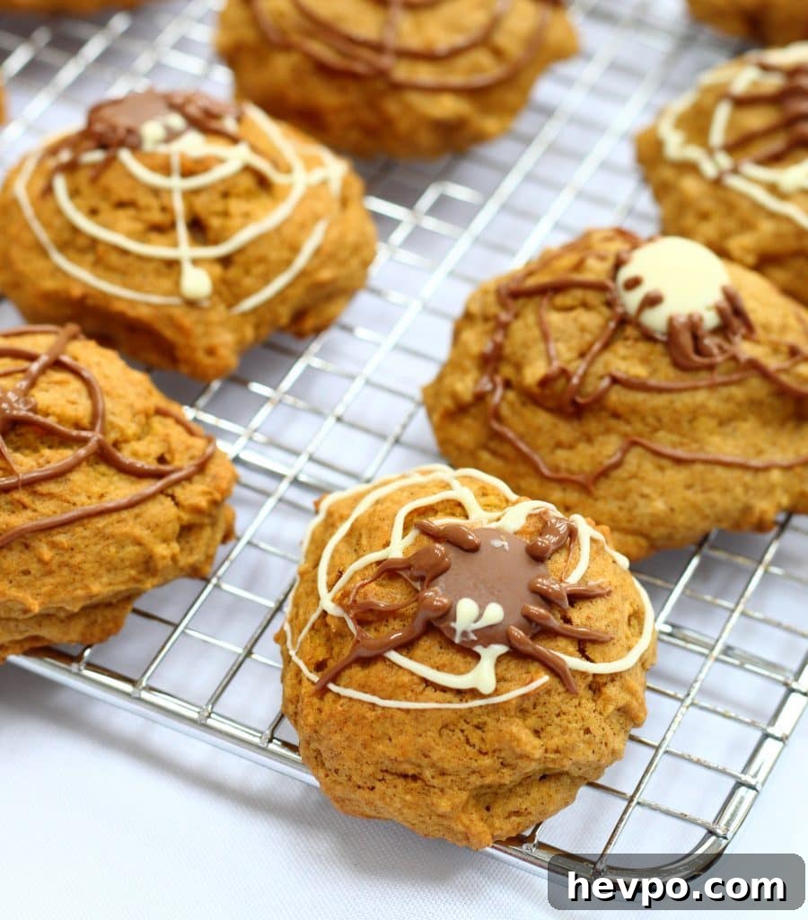 Spiced pumpkin cookies for Halloween on a cooling rack