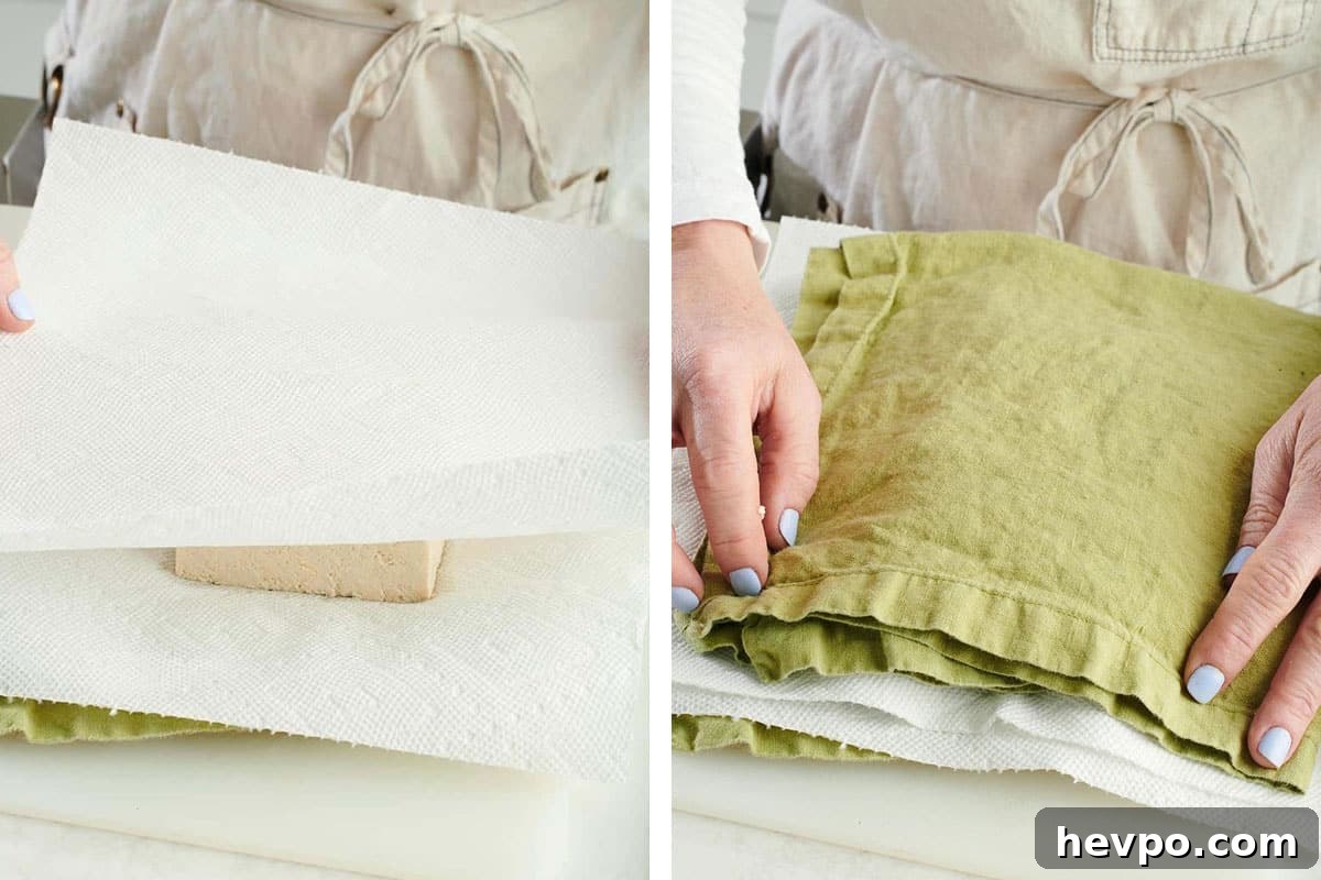 How to Press Tofu for Firmer, Crispier Results 4 Woman placing paper towels and green cloths onto a stack of tofu.