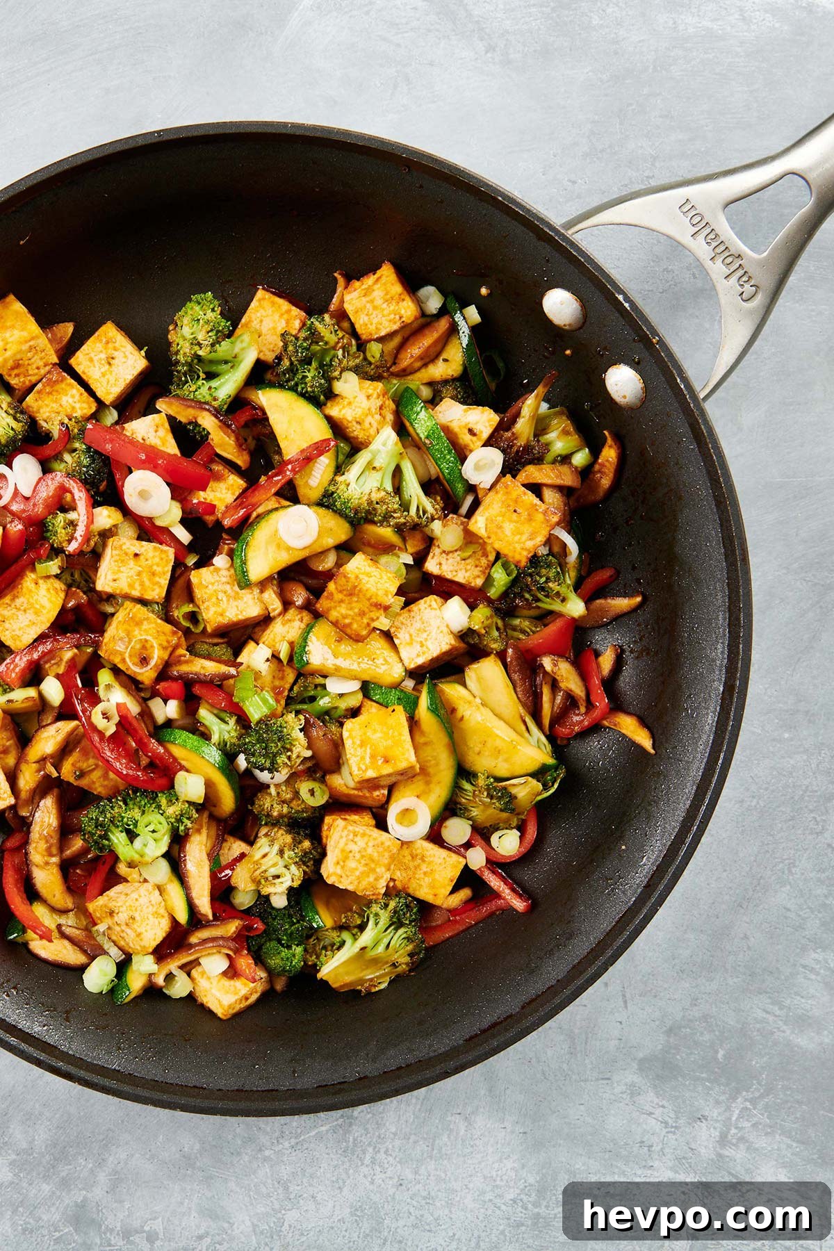 How to Press Tofu for Firmer, Crispier Results 10 Stir Fried Crispy Tofu and Vegetables in a skillet.