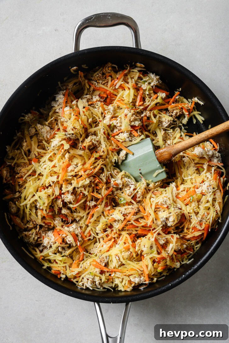 Filling for Chicken Spring Rolls in a skillet.