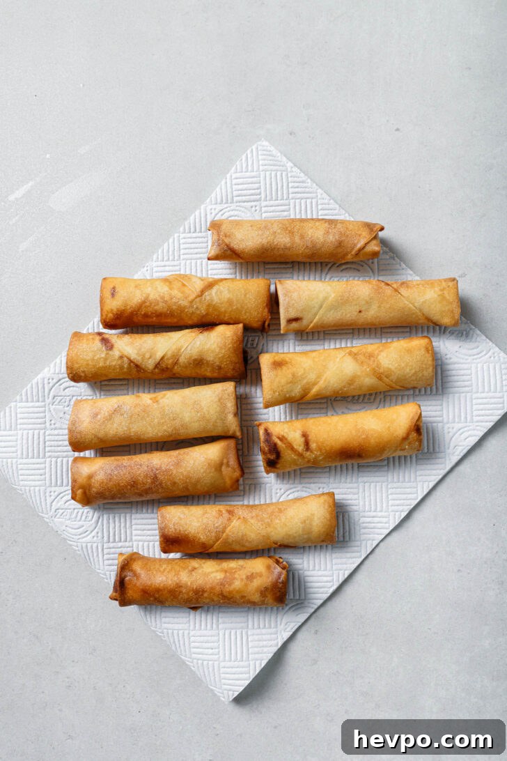 Fried Chicken Spring Rolls on a piece of paper towel.