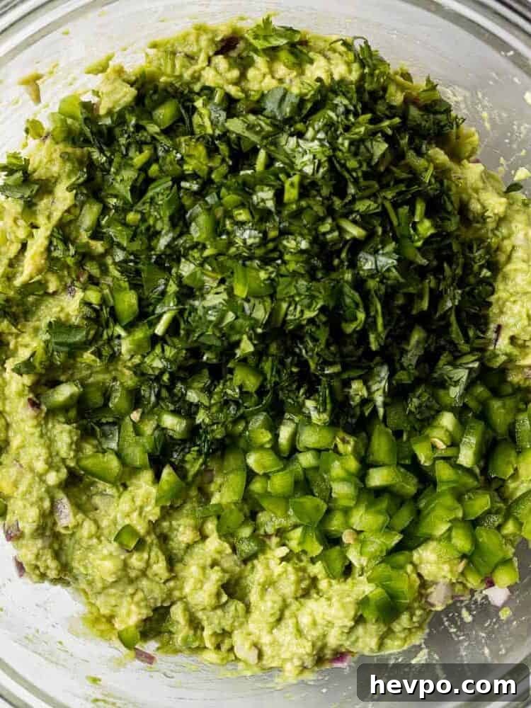 Jalapeno and cilantro on top of mashed avocado.
