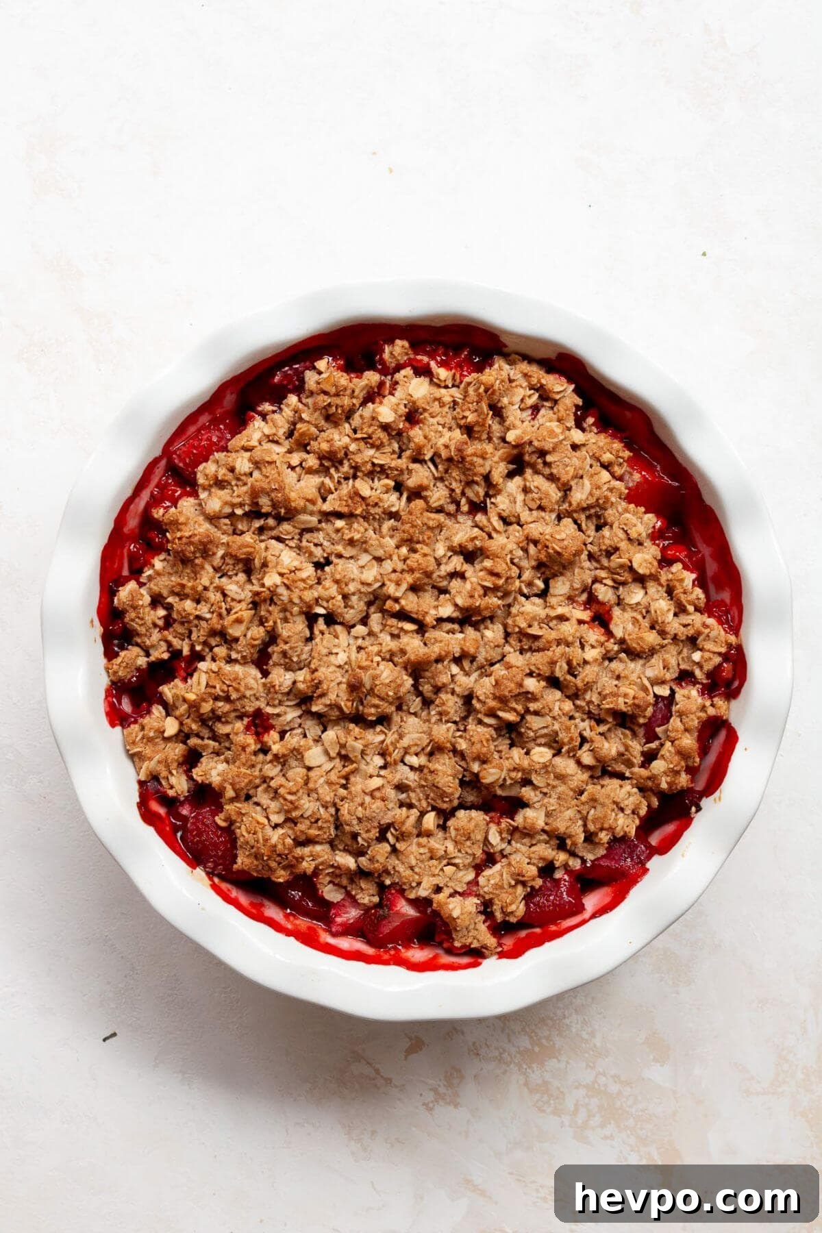 Strawberry Crumble with Oat Topping Recipe 8 Golden-brown oat crumble topping over bubbling strawberry filling fresh from the oven.