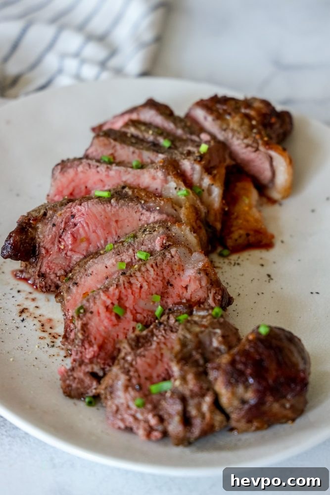 picture of sliced steak on a white plate