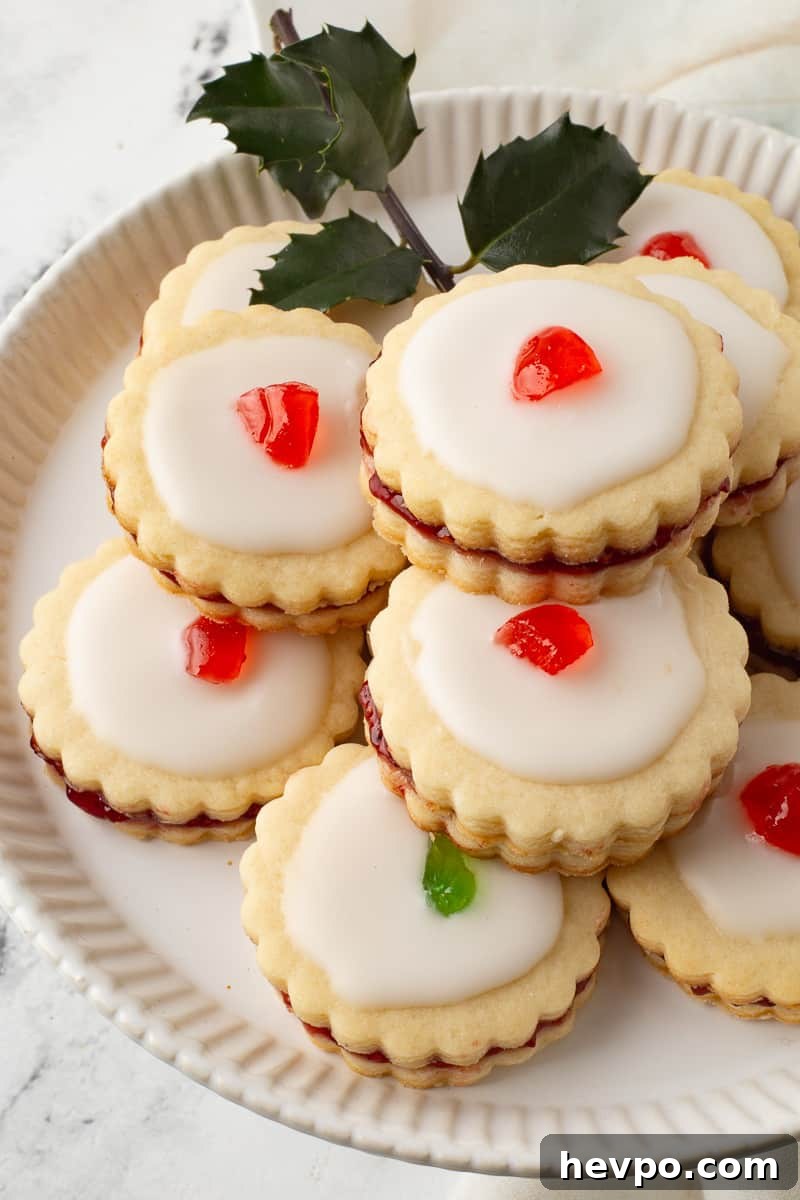 Empire cookies on white plate.
