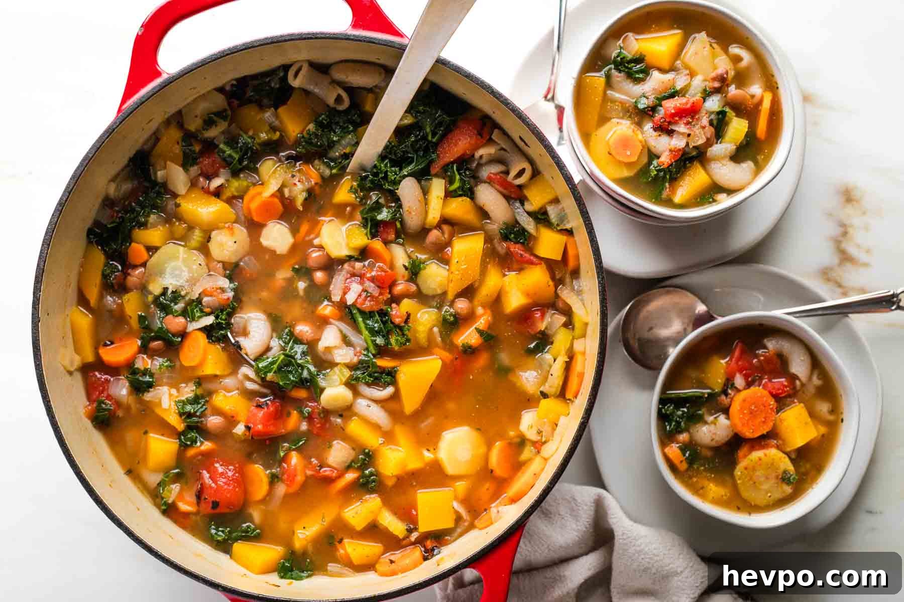 Autumn Vegan Minestrone: Hearty Fall Vegetable Soup 13 Ladling chunky minestrone soup from a dutch oven into bowls.