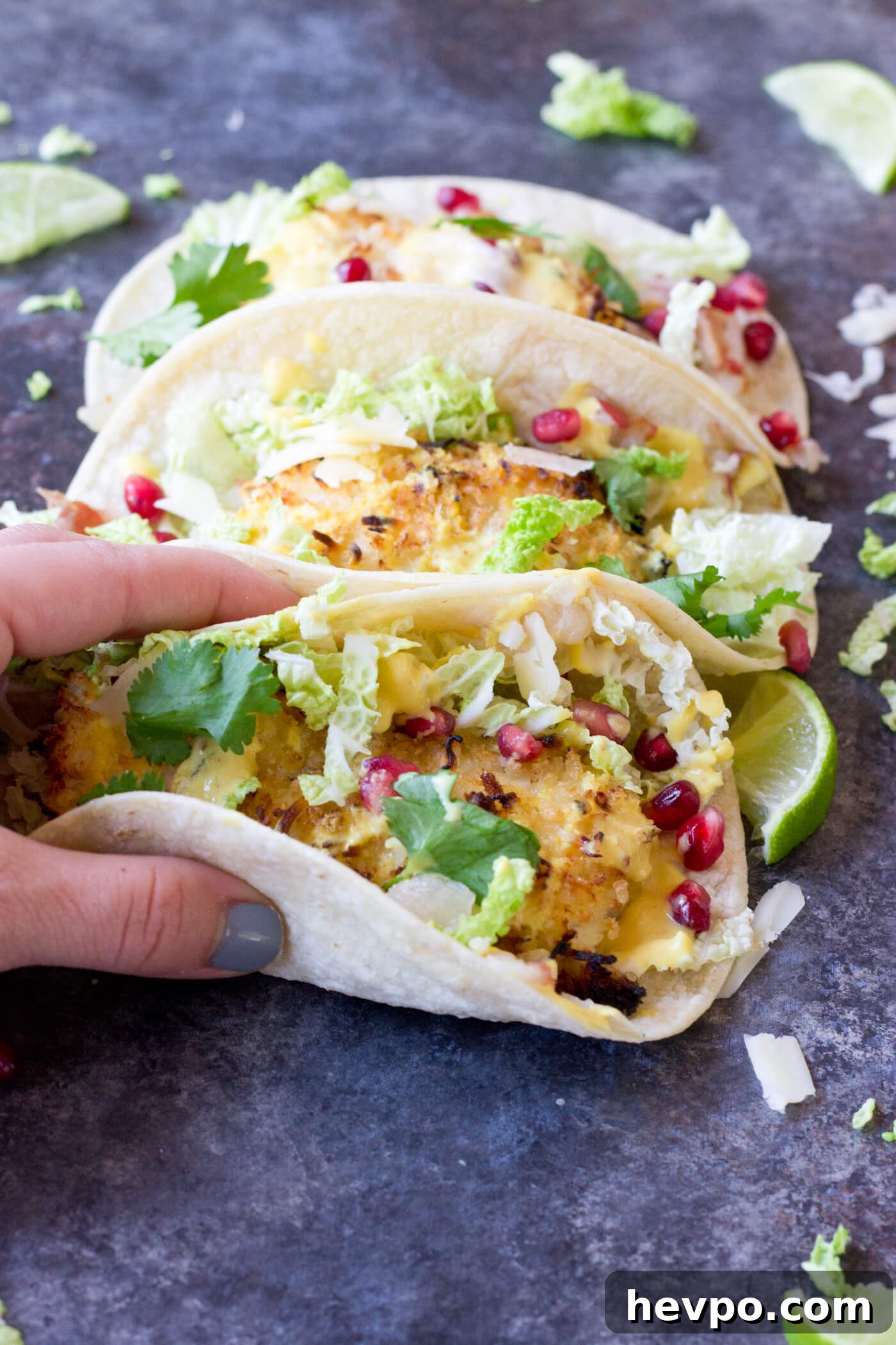 Crispy Fish Tacos with Pomegranate, Pear & Honey-Lime Crema 2 Crazy for tacos? Add these Crispy Fish Tacos to your menu! Crispy baked cod topped with pomegranates, shredded pear, and Honey Lime Crema. Simple to make at home!