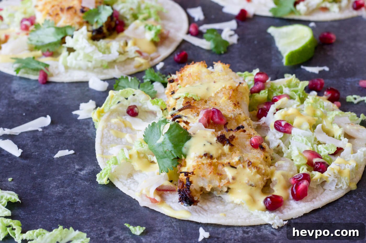 Crispy Fish Tacos with Pomegranate, Pear & Honey-Lime Crema 3 Crazy for tacos? Add these Crispy Fish Tacos to your menu! Crispy baked cod topped with pomegranates, shredded pear, and Honey Lime Crema. Simple to make at home!