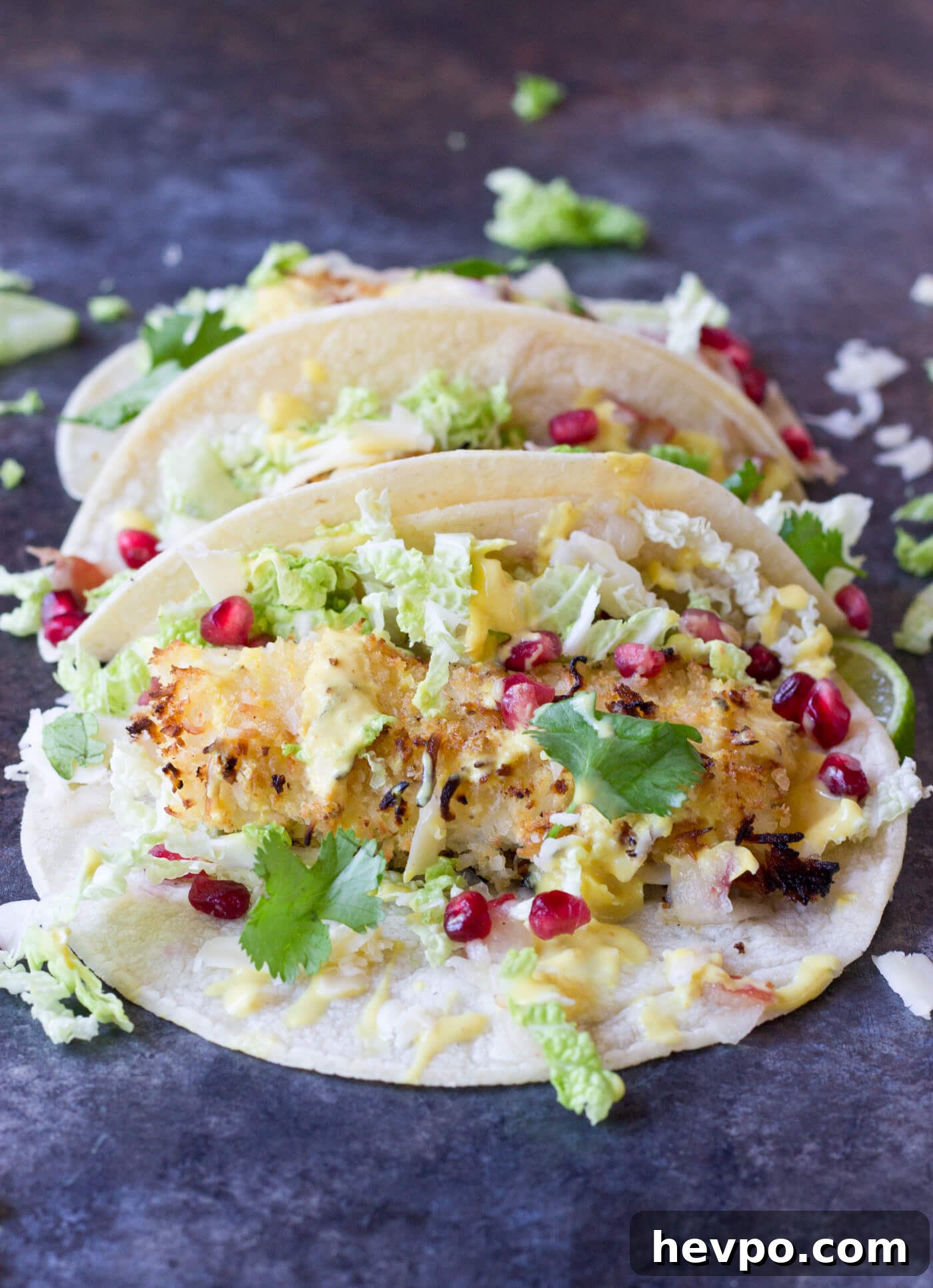 Crispy Fish Tacos with Pomegranate, Pear & Honey-Lime Crema 4 Crazy for tacos? Add these Crispy Fish Tacos to your menu! Crispy baked cod topped with pomegranates, shredded pear, and Honey Lime Crema. Simple to make at home!