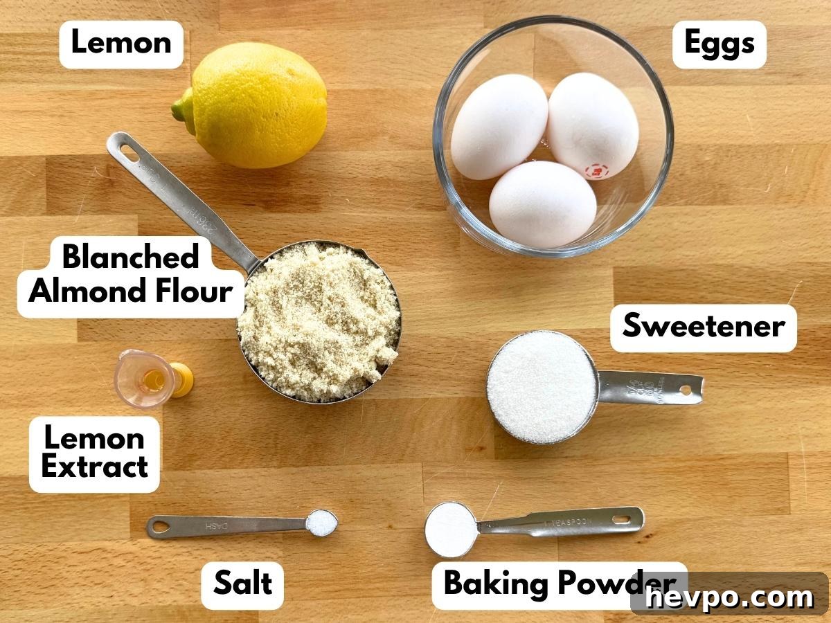 Labeled ingredients to make flourless lemon almond cake: a lemon, 3 eggs, almond flour, stevia, lemon extract, salt, and baking powder.