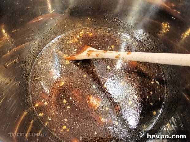 Beef broth and seasonings added to the Instant Pot