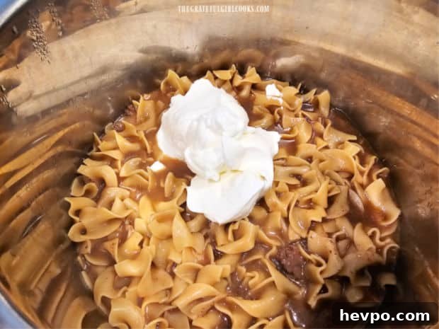 Sour cream stirred into stroganoff