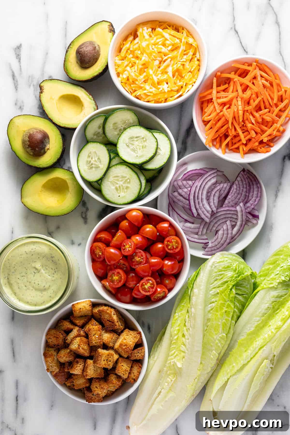 Bowls of ingredients to make a house salad.