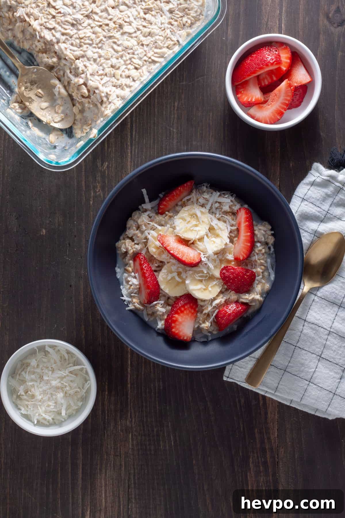 Coconut Milk Overnight Oats Recipe for Creamy Breakfast 2 A bowl of overnight oats with coconut milk topped with shredded coconut, berries and maple syrup.