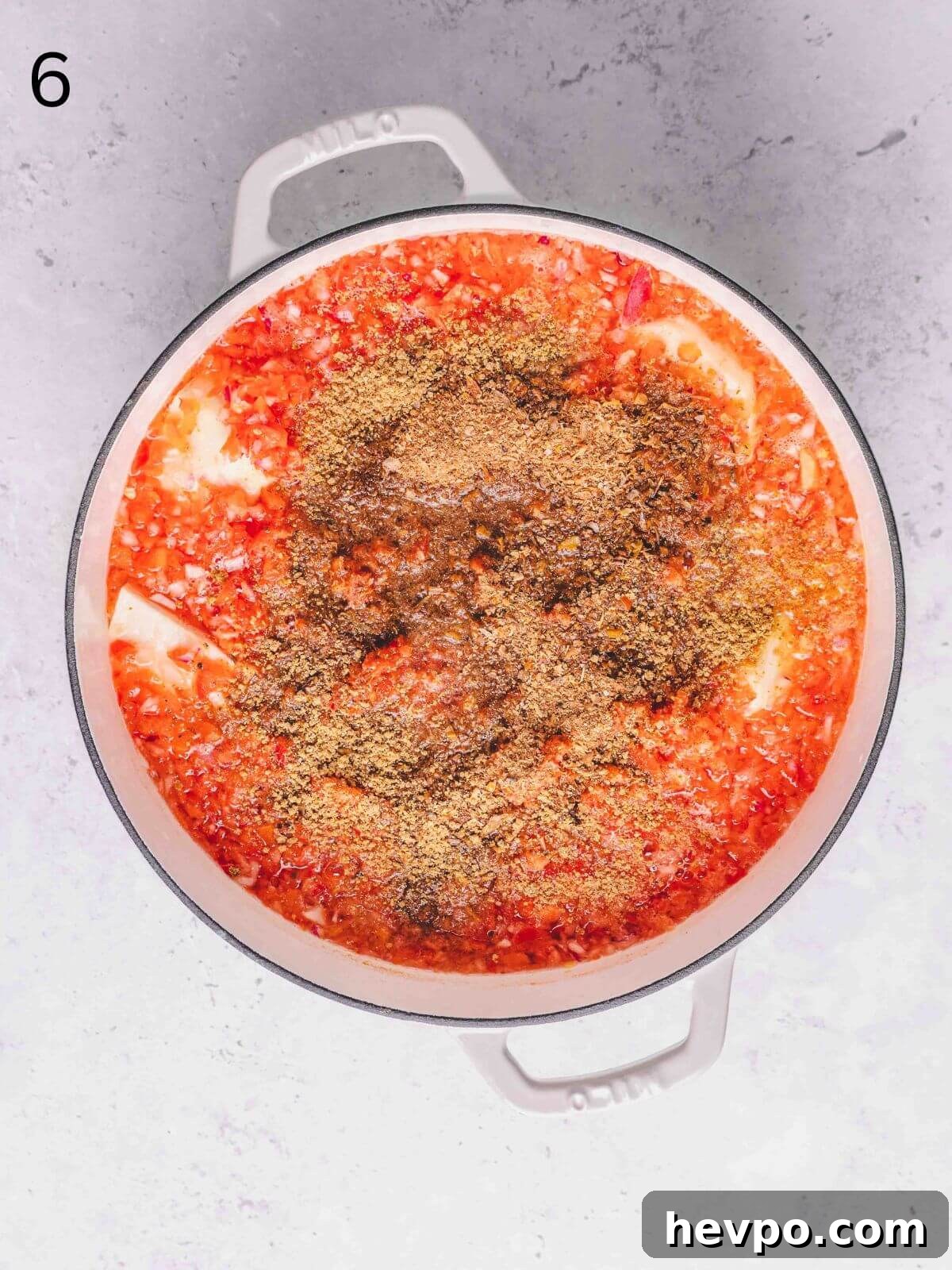 Asaro: Authentic Nigerian Yam Porridge Recipe for Flavorful Comfort 6 Pepper mix, crayfish and palm oil added into the pot with yam.