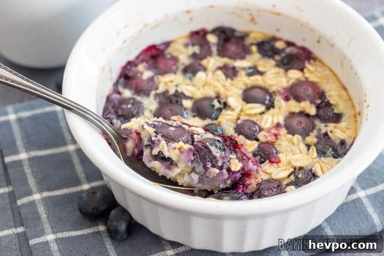 Single-Serve Baked Oats Recipe for One: Quick Breakfast Bowl 3 spoon resting in bowl of baked oatmeal