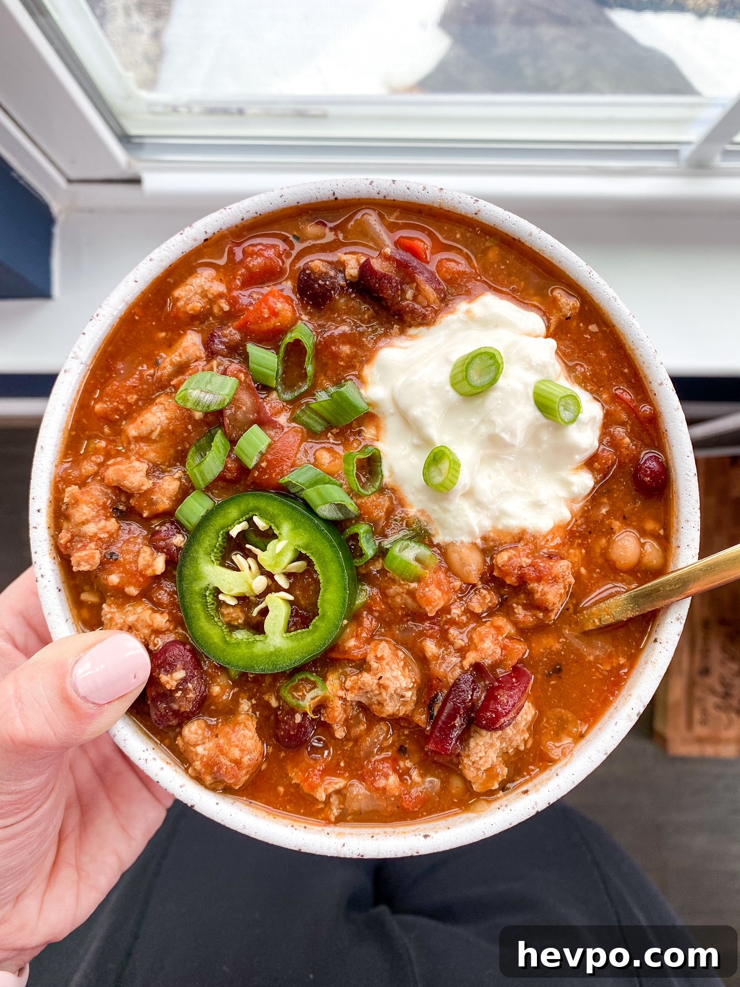 person holding a bowl of food