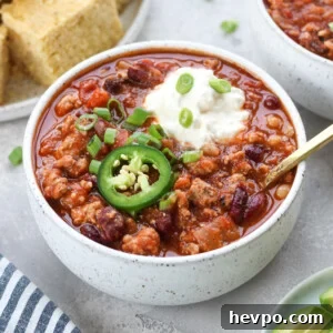 Slow cooker turkey chili with sour cream and jalapeño