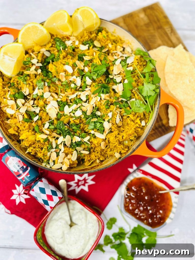 Leftover Turkey Biryani Recipe: Quick Flavorful Turkey Biryani 9 leftover turkey biryani served in an orange skillet pan. Bowl of Indian mint yogurt and mango chutney on the side along with some poppadoms