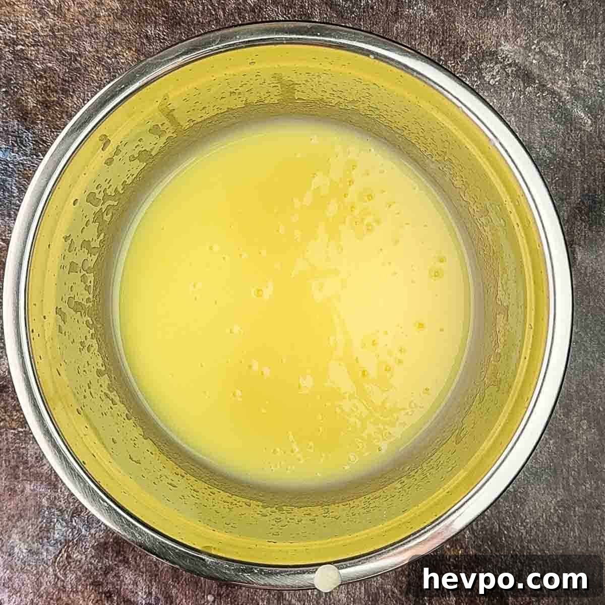 The vanilla pudding in a mixing bowl ready to be refrigerated.
