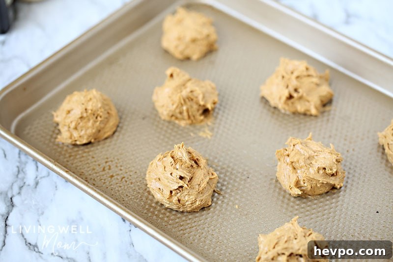 Gluten-Free Frosted Ginger Cookies Recipe — Soft, Spiced Treats 10 ginger cookie dough on cookie sheet unbaked