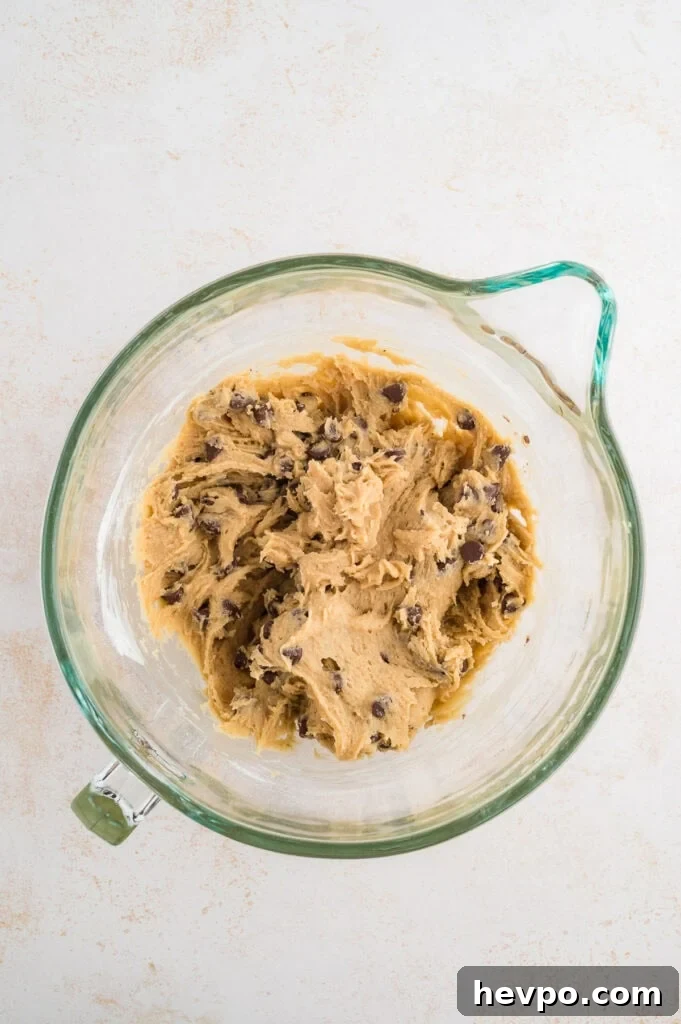 Gluten-Free Chocolate Chip Cookies Loved by Non-GF Eaters 9 Gluten free chocolate chip cookies dough in a glass kitchenaid mixer.