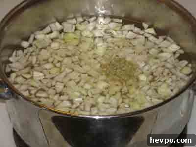Garbanzo soup ingredients in pot.