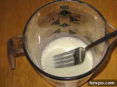Keep whisking in small amounts of water.