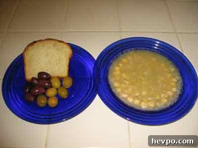 Revithia soup served with bread and olives.