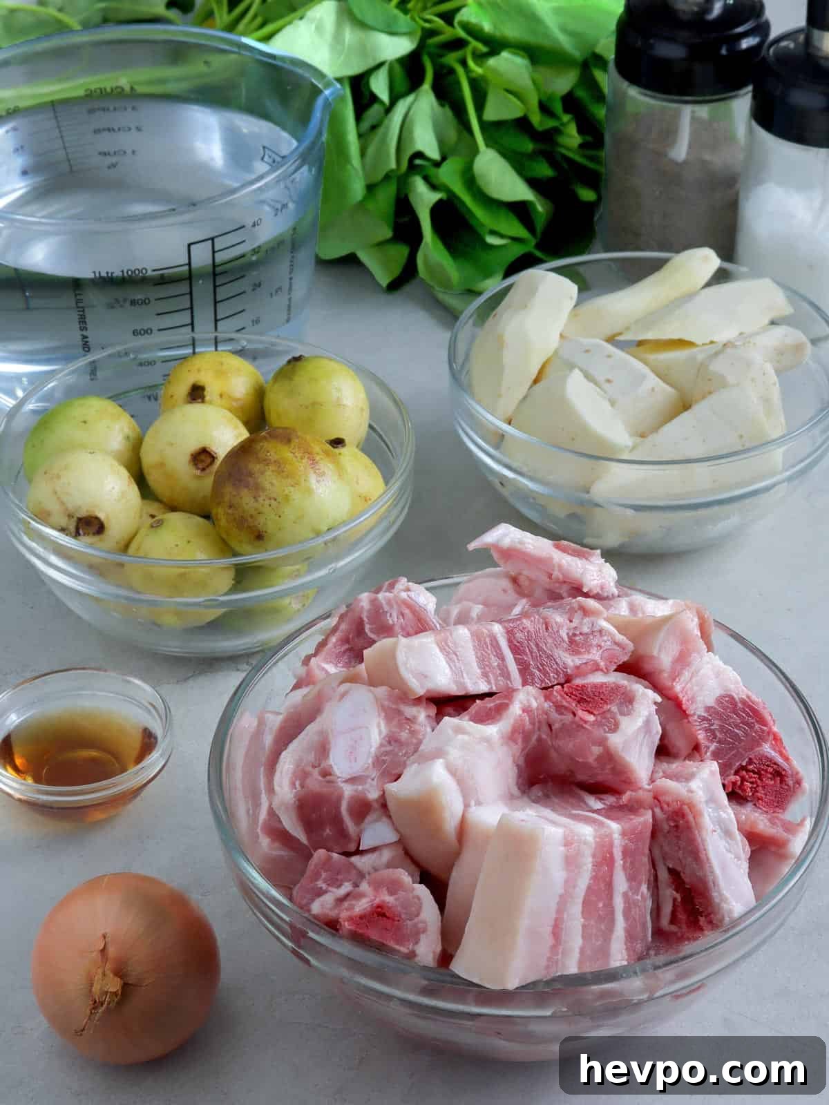 Bulanglang Pork Stew: Filipino Spiced Pork in Sour Broth 3 guavas, pork belly, gabi, kangkong, fish sauce, onion, water