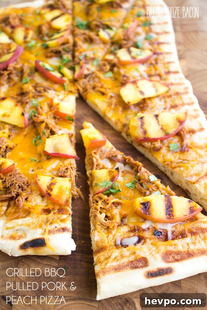 Grilled BBQ Pulled Pork and Peach Pizza Recipe 2 Grilled BBQ Pulled Pork & Peach Gourmet Pizza Recipe is one of those bites of food bliss you just can't stop eating! I love the combination of luscious, fatty pork with fresh peaches and cilantro!