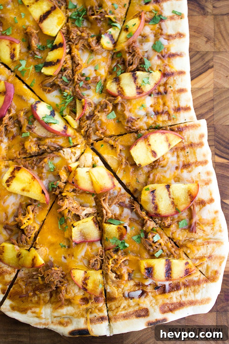 Grilled BBQ Pulled Pork and Peach Pizza Recipe 6 Grilled BBQ Pulled Pork & Peach Gourmet Pizza Recipe is one of those bites of food bliss you just can't stop eating! I love the combination of luscious, fatty pork with fresh peaches and cilantro!