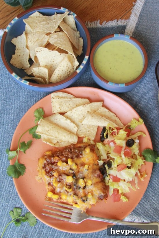 Beef Enchilada Casserole is a quick and easy Mexican meal full of flavor. Beef Enchilada Casserole serving with chips and salsa.