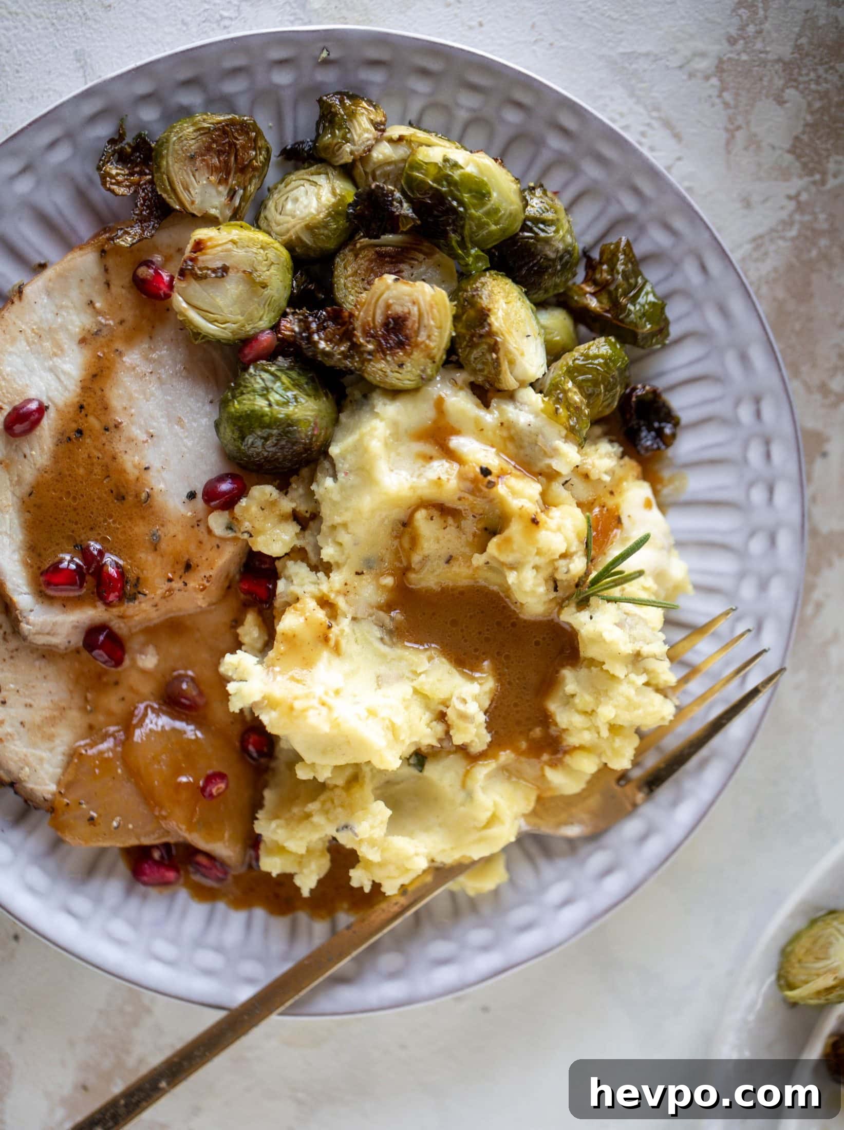 This pork loin roast is perfect for the holiday or winter season! Pomegranate and cider glazed, it's wonderful! Serve with smashed rosemary potatoes.
