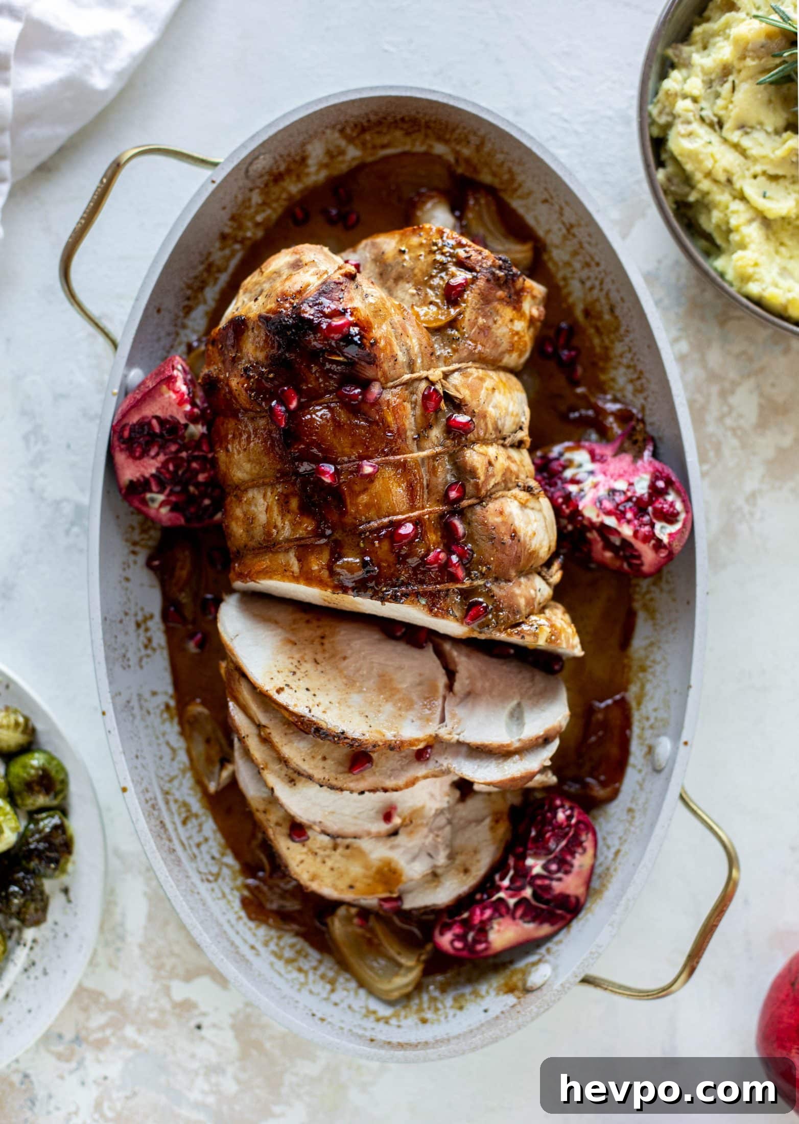 This pork loin roast is perfect for the holiday or winter season! Pomegranate and cider glazed, it's wonderful! Serve with smashed rosemary potatoes.