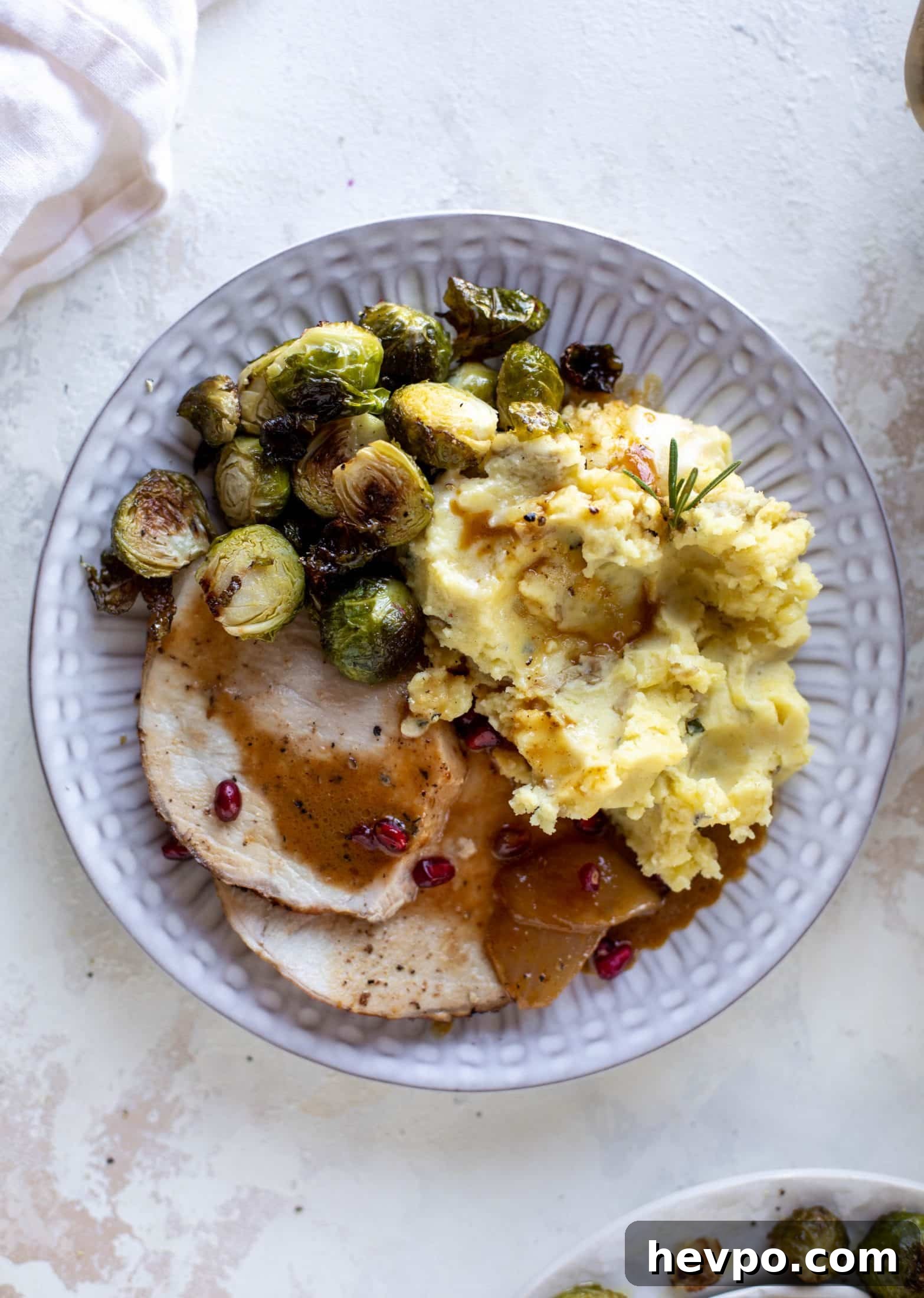 This pork loin roast is perfect for the holiday or winter season! Pomegranate and cider glazed, it's wonderful! Serve with smashed rosemary potatoes.
