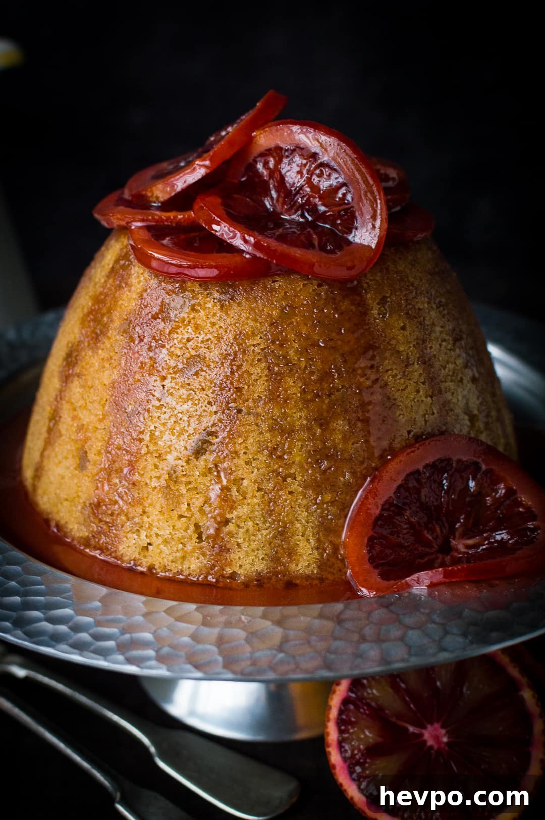 Close-up of a Crock-Pot steamed blood orange and ginger pudding topped with candied blood orange slices