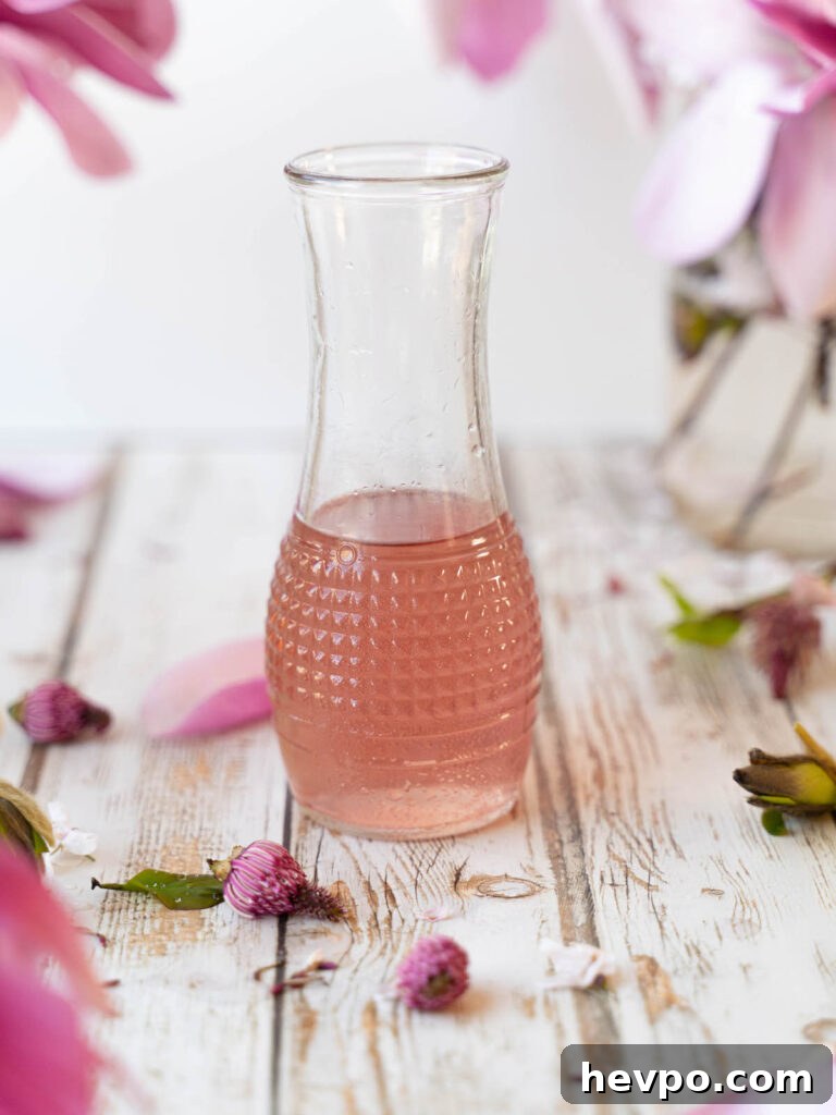 Magnolia Flower Syrup Recipe & Uses for Flavor and Wellness 2 Magnolia flower syrup in a glass container