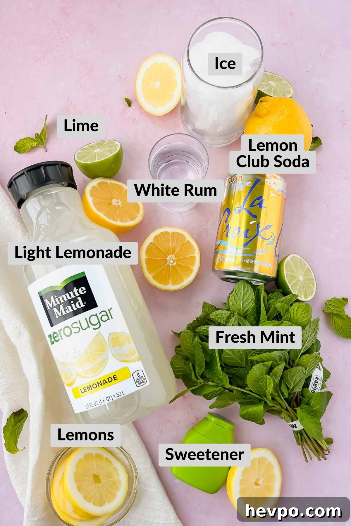 Lemonade Mojito Recipe: Refreshing Low-Calorie Twist 3 ingredients for skinny lemonade mojito on pink background.