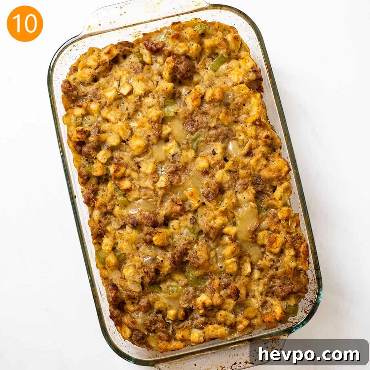 Italian sausage stuffing baked in a glass baking pan.