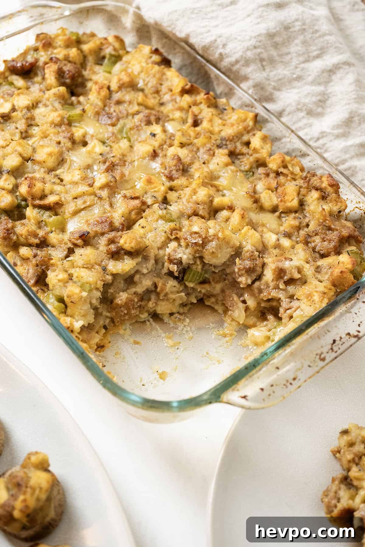 Italian sausage stuffing baked in a glass baking pan.