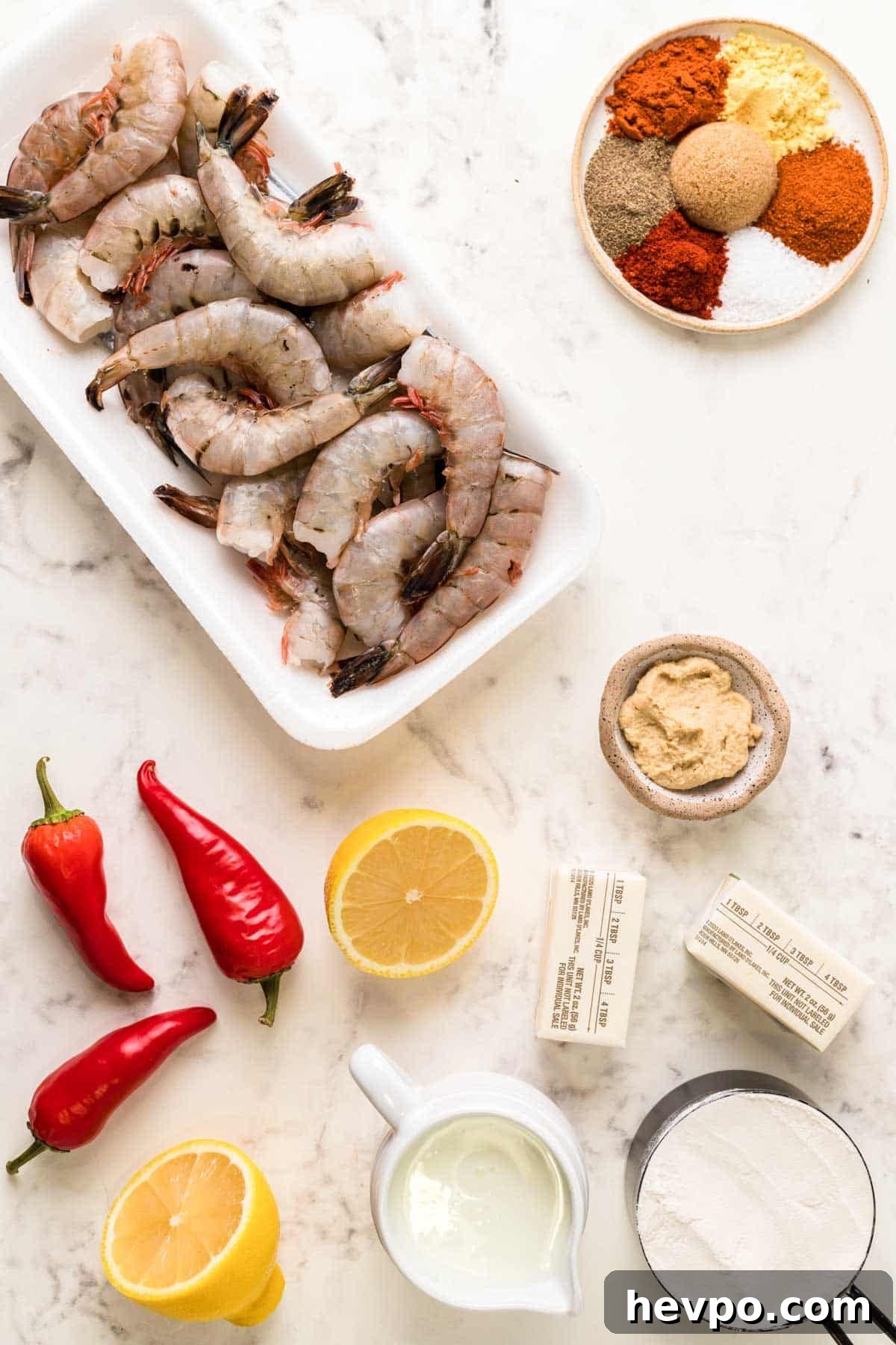 LongHorn-Style Wild West Shrimp Recipe: Copycat Steakhouse Dish 4 Overhead photo of ingredients to make wild west shrimp on a marble counter.