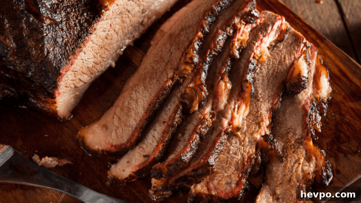 Cooked Brisket Slices on Wooden Board
