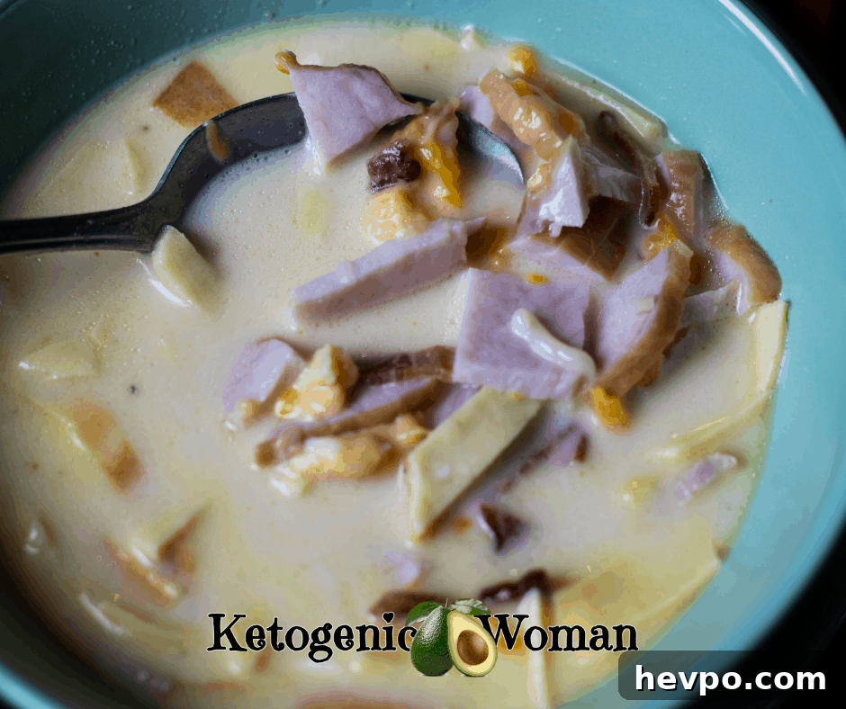 ham and cheese soup in blue bowl with spoon